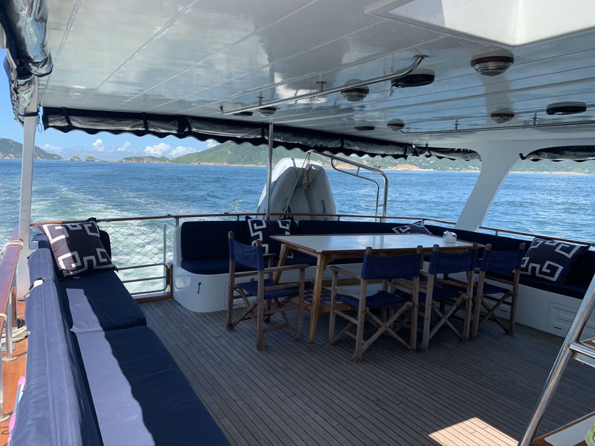 Deck sofas and dining table under way