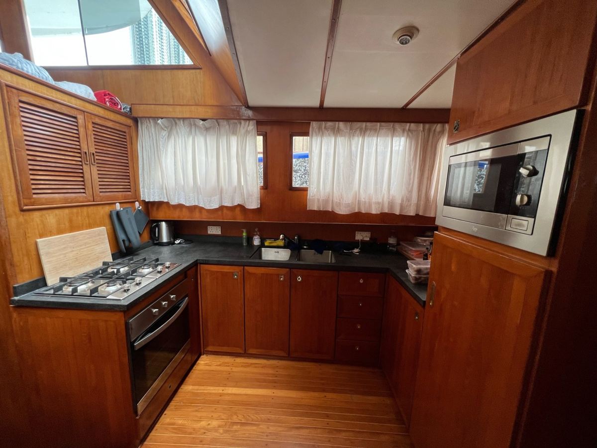 Teak galley with oven, hob and microwave