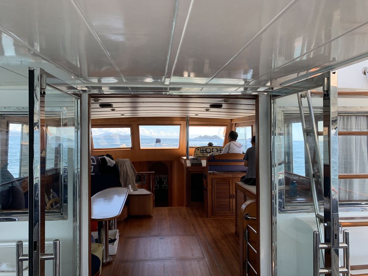 View through the glass doors into the teak saloon